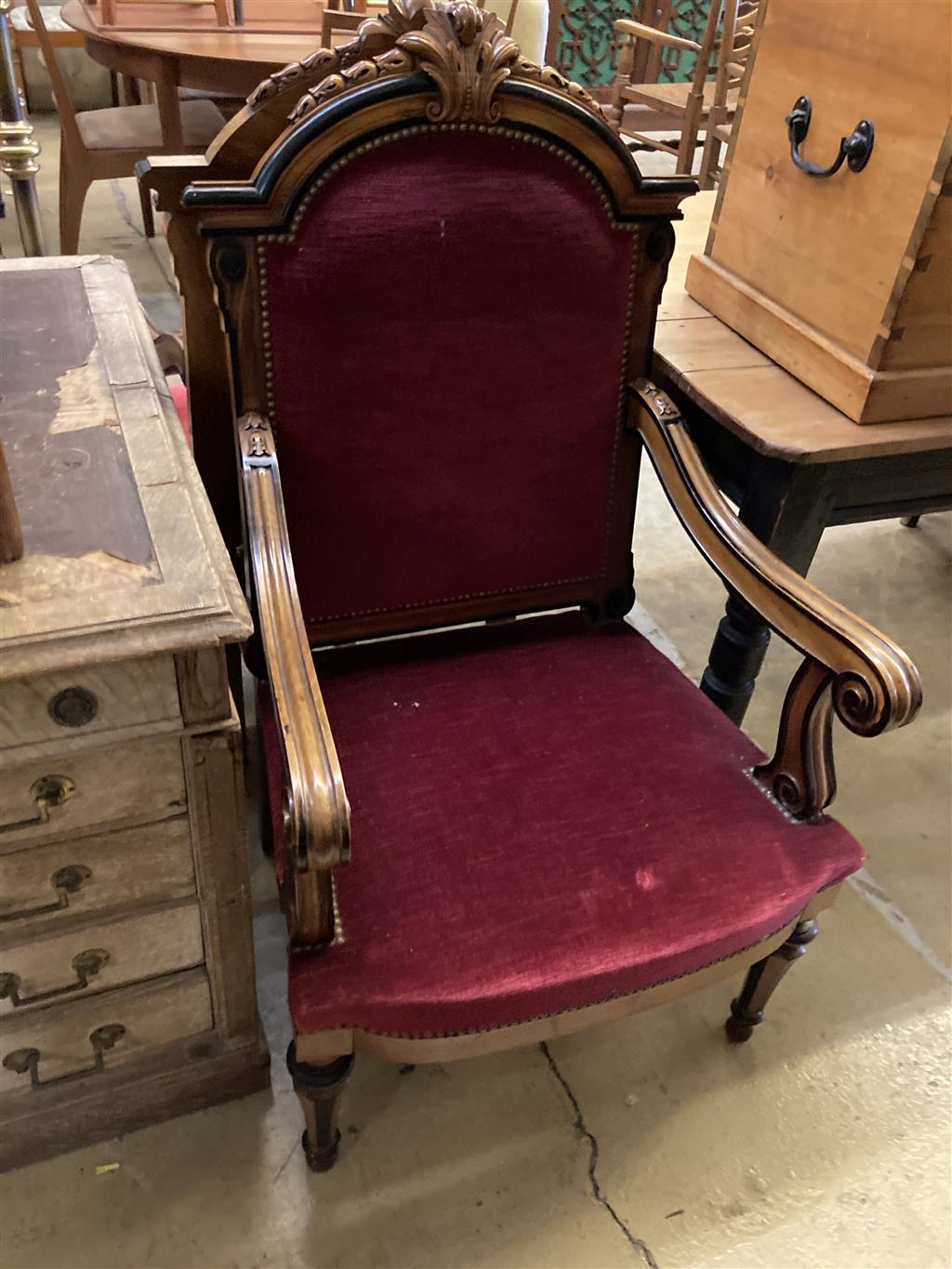 A pair of 19th century Continental carved walnut and ebonised chairs, width 63cm, depth 60cm, height 110cm